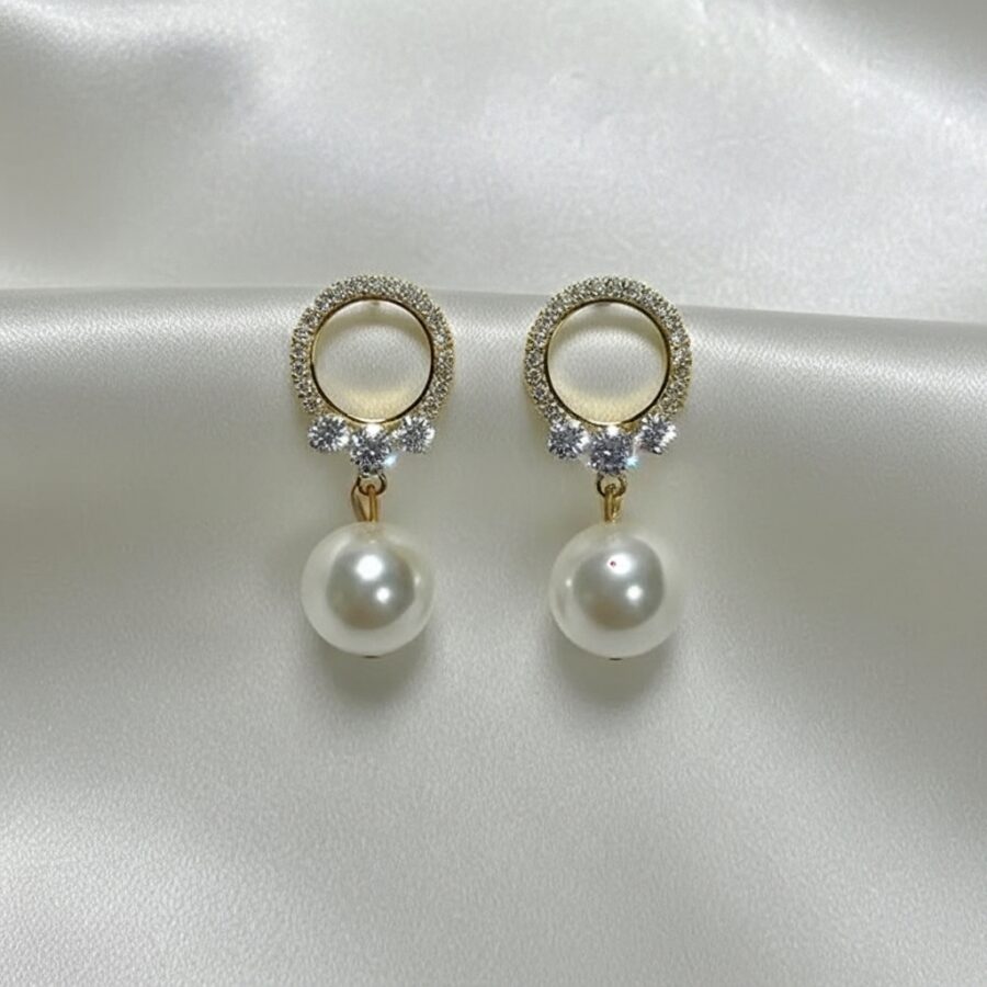 Celeste Gold Pearl Stud Earrings
